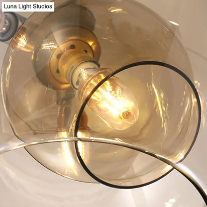 Lámpara de araña moderna de cristal ámbar/transparente para comedor con tres luces.