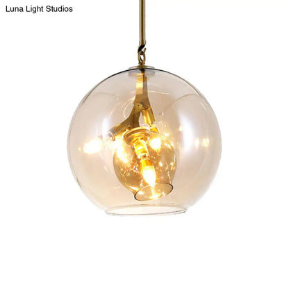 Lámpara de araña moderna de cristal ámbar/transparente para comedor con tres luces.