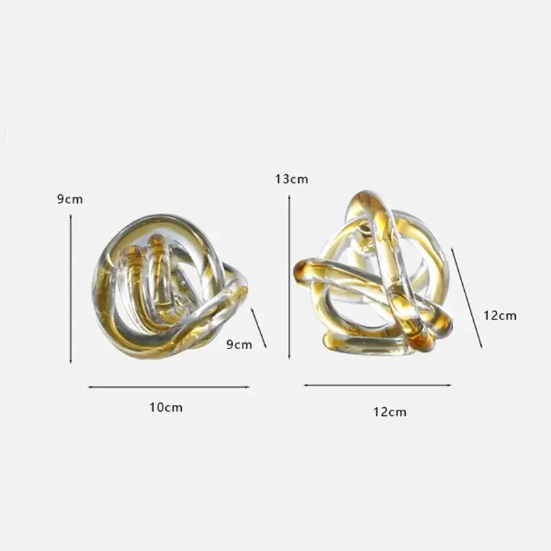 Modern amber and clear glass knot twist sculpture with intertwined golden loops for living room decorbites glass knot