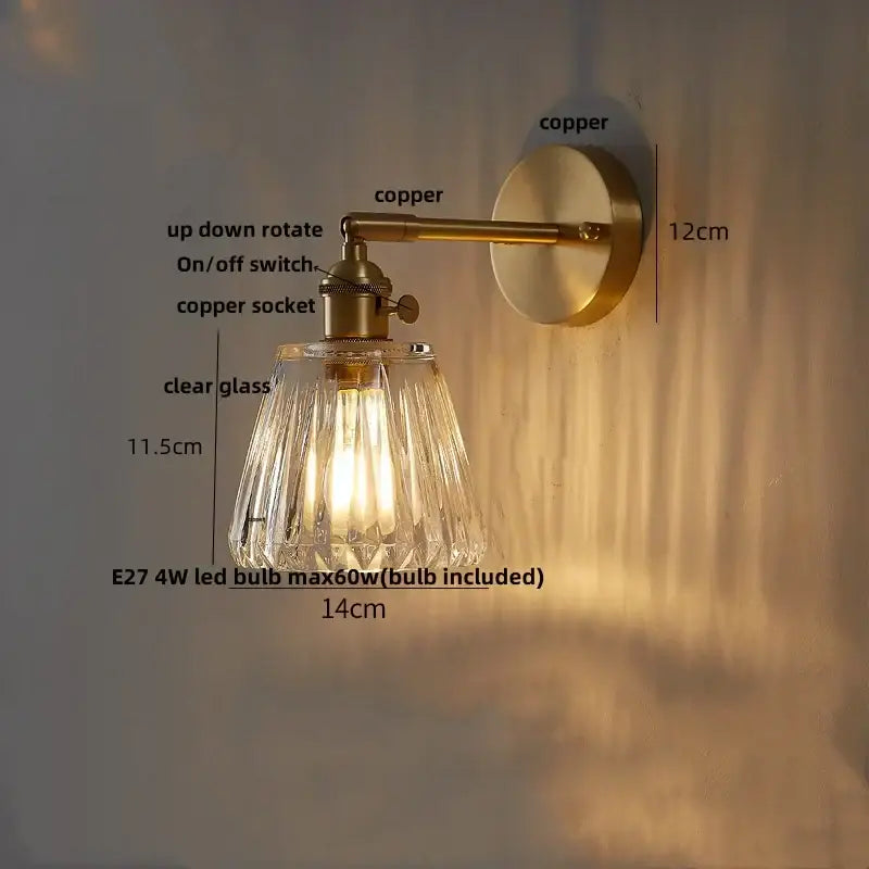 Modern amber clear glass wall sconce with brass-finished copper arm and decorbites clear glass shade for bedroom decor