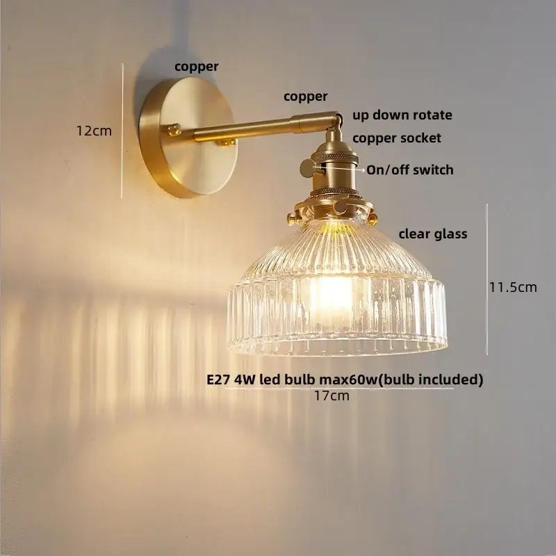 Modern amber clear glass wall sconce with brass finish, ribbed clear glass shade, and adjustable copper arm decorbites clear glass