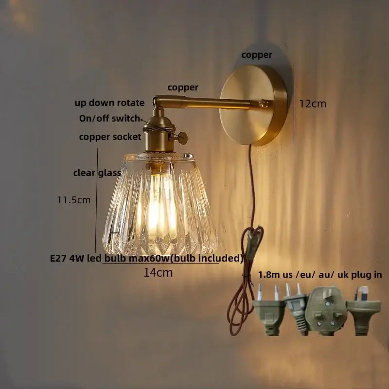 Modern amber clear glass wall sconce with brass-finished copper arm and decorbites clear glass rotating shade