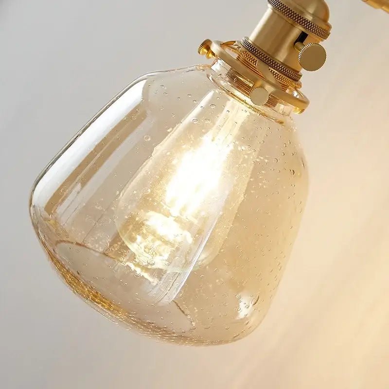 Modern amber clear glass wall sconce with textured amber glass and brass fittings for bedroom decorbites clear glass lighting
