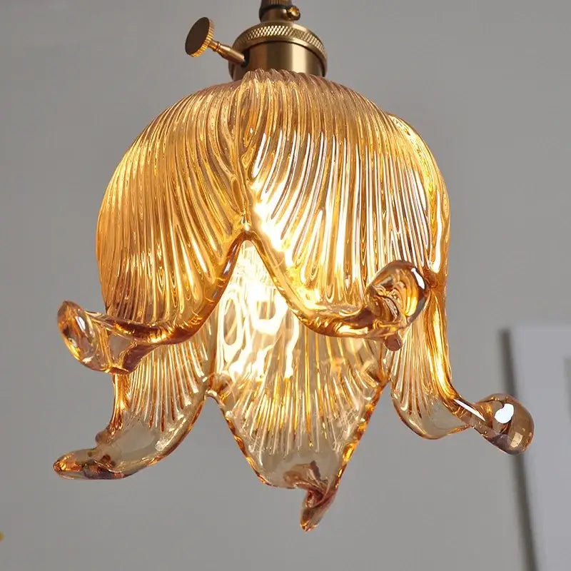 Modern amber copper glass led pendant light with golden amber ribbed flower design and brass hardware decorbites copper glass