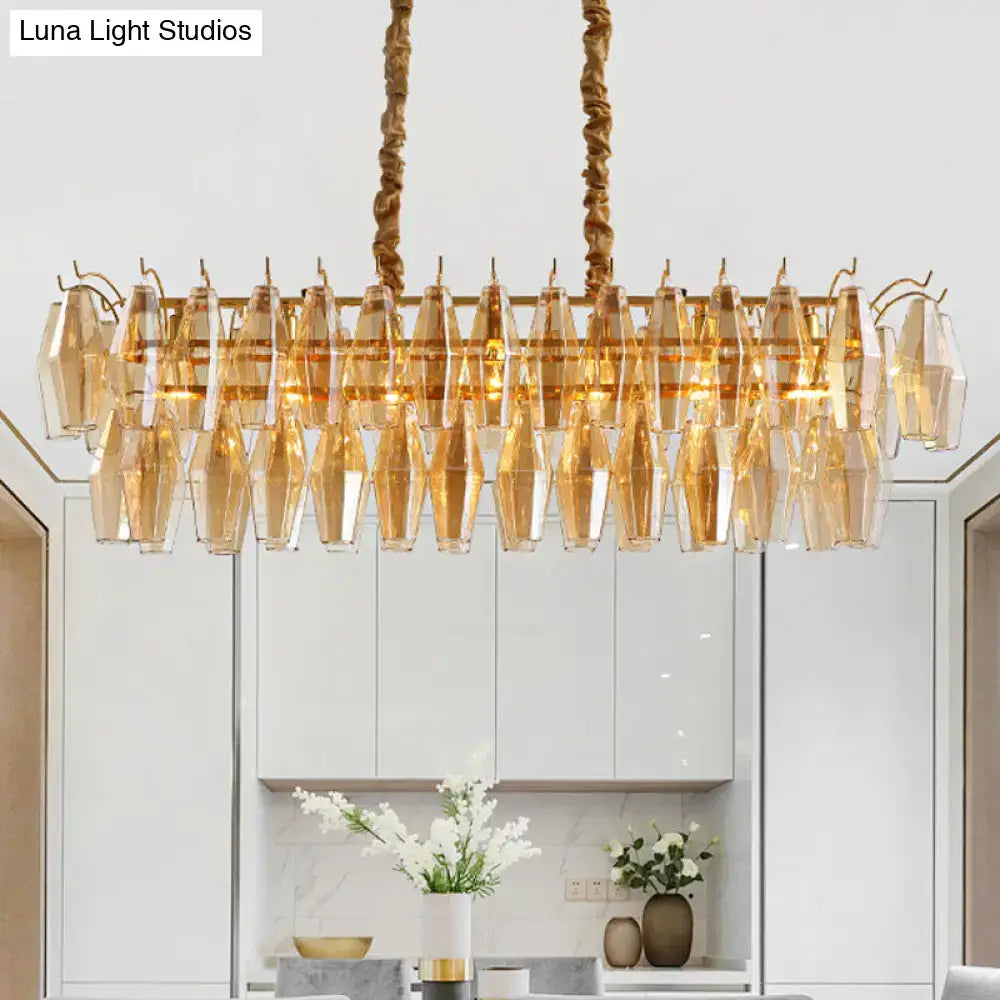 Gold-toned modern amber crystal oval island light fixture with faceted glass crystals for dining room use