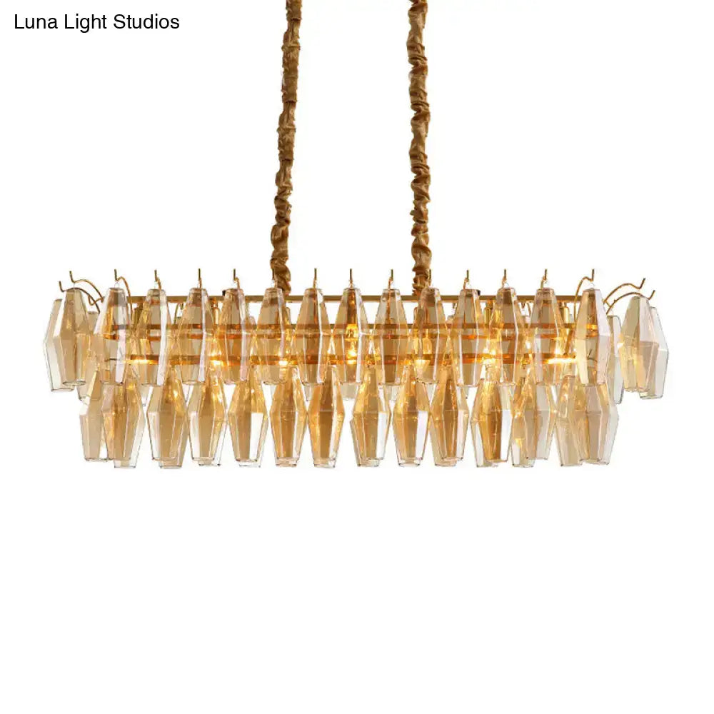 Gold-toned modern amber crystal oval island light fixture with faceted glass crystals for dining room use