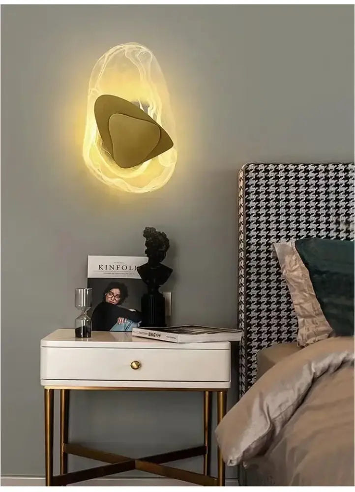 Modern amber crystal wall lamp with warm-toned translucent glass and bronze sculptural gold leaf accent for decorbites crystal wall lighting