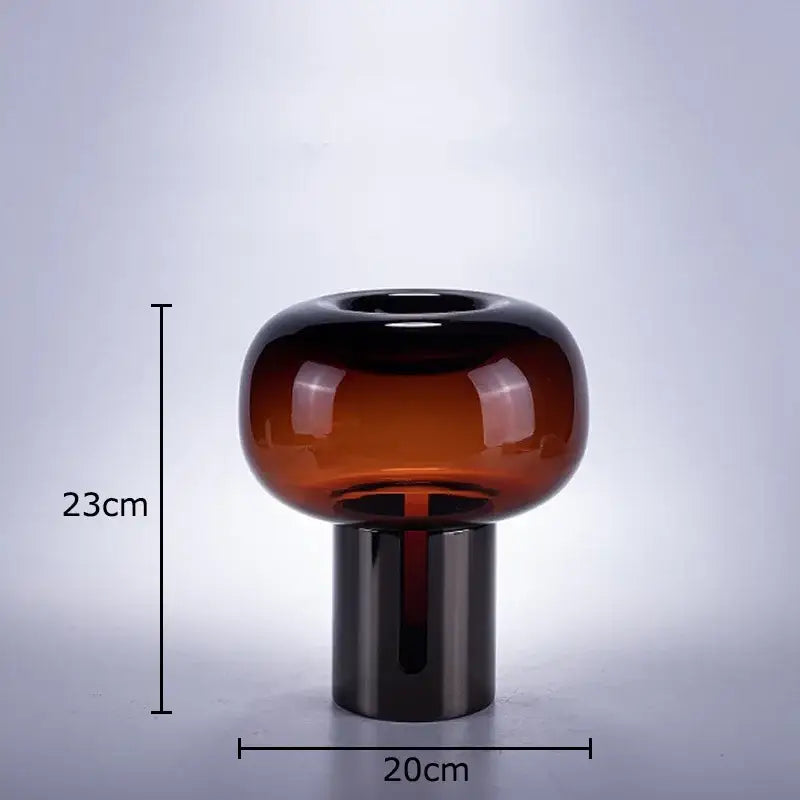 A sleek amber-tinted decorbites dark glass vase with rounded top and cylindrical base for modern office desk decor