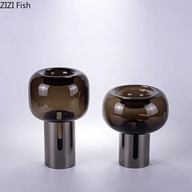 Two sleek modern decorbites dark glass vases with amber hue and silver bases for office desk decor