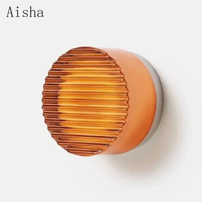 Aisha brand amber-colored acrylic sconce led wall lamp with ribbed texture and smooth base for modern living room decorbites