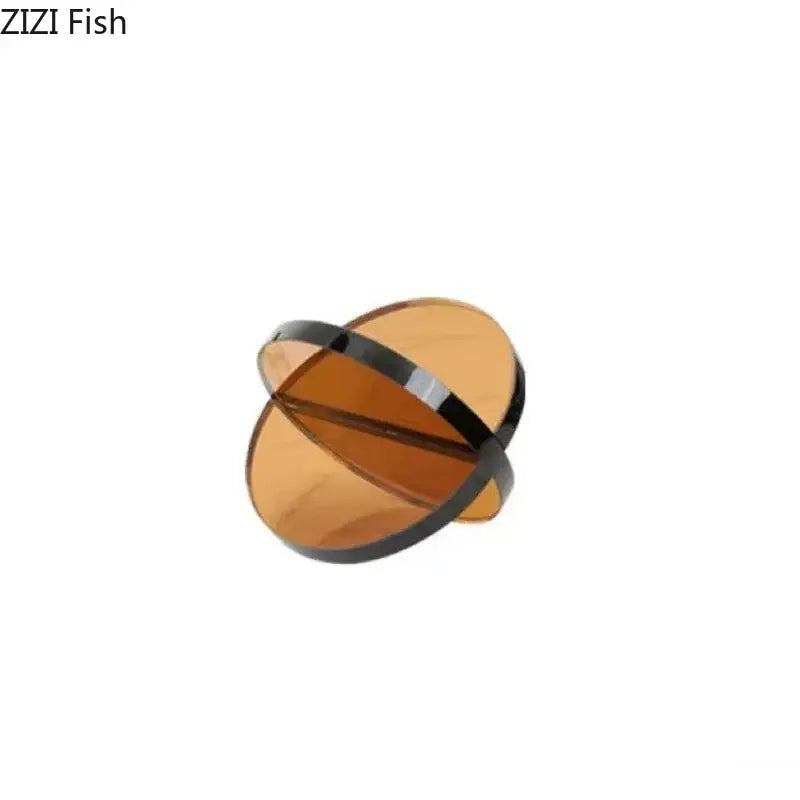 Modern amber geometric cross ornaments living room bookends with amber-tinted translucent ring and sleek black metal band decorbites geometric cross
