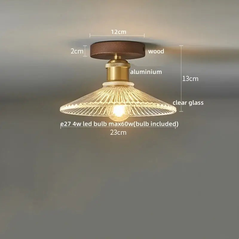 Vintage-style led ceiling lamp with amber glass shade, brass aluminum stem, and dark wood base for dining room use