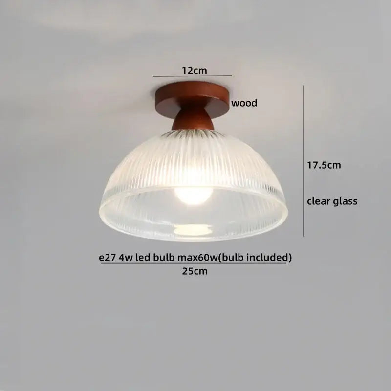 Modern amber glass and brass led ceiling lamp with warm-toned wooden fixture and clear ribbed glass shade for dining room