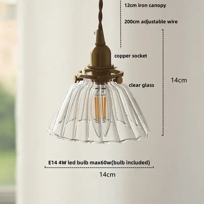 Antique brass-finished pendant light with clear fluted glass shade and e14 led bulb in modern amber glass ball style