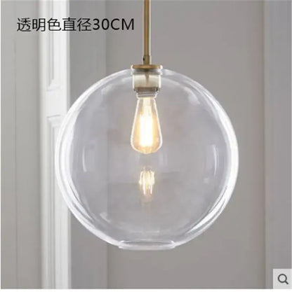Modern amber glass ball led pendant light with clear spherical glass ball and brass-finished decorbites glass ball rod
