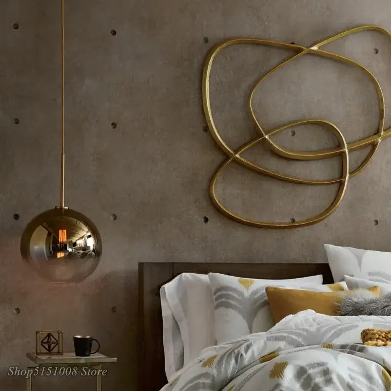 Modern amber glass ball led pendant light with gold-toned reflective spherical glass ball led fixture for kitchen decorbites decor