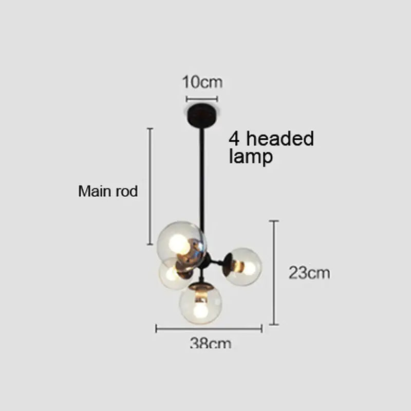 Modern amber glass ball pendant light with black metal rod and four clear glass globe bulbs for dining room decorbites glass ball
