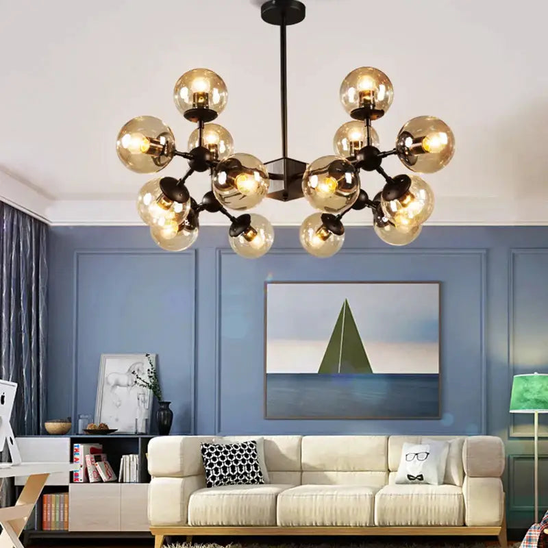 Modern amber glass ball pendant light with multiple amber glass globe bulbs and black metal frame for dining room decorbites glass ball pendant light