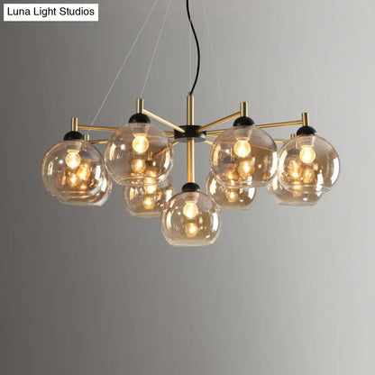 Lámpara de techo moderna de cristal ámbar con 9 bombillas y acabado en latón para salón