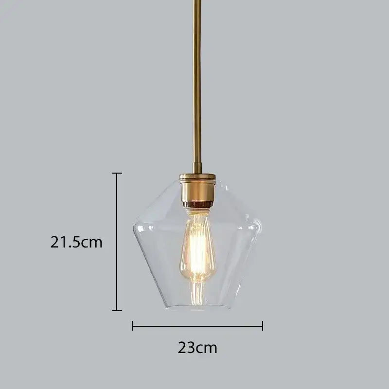 Modern amber glass chandelier with clear glass shade and brass pendant light featuring exposed filament bulb for living room