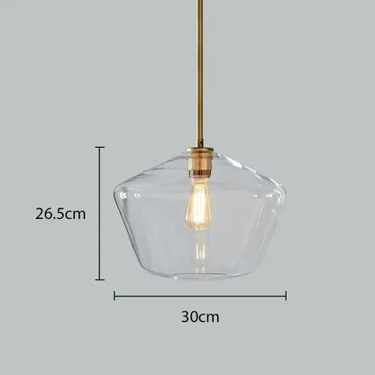 Modern amber glass chandelier with brass pendant light featuring clear glass and exposed filament bulb for living room