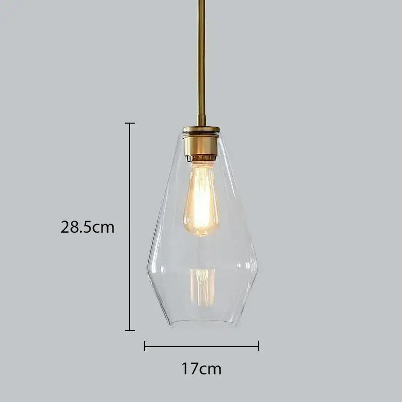Modern amber glass chandelier pendant light with brass fixture and clear glass housing exposed filament bulb for living room