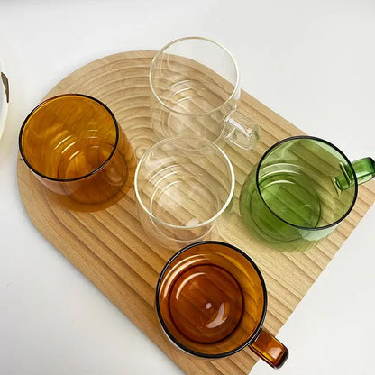 Set of four decorbites glass coffee mugs in amber clear and green with black rims for kitchen and dining room use