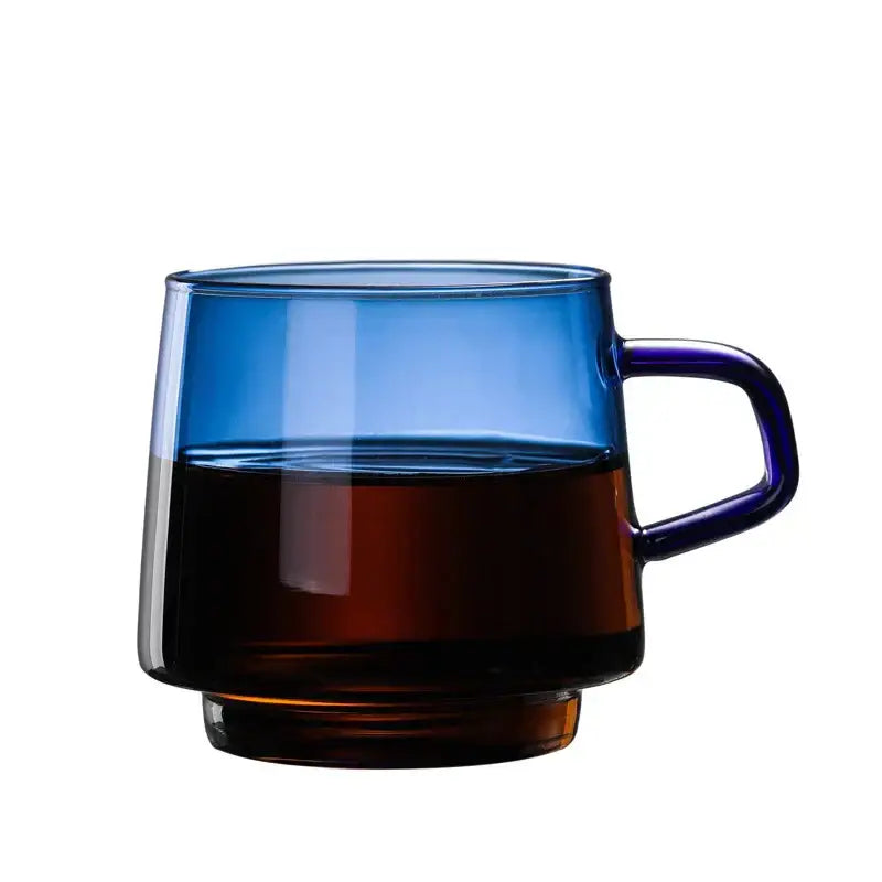 Modern amber glass coffee mug with black rim and sleek handleless design by decorbites glass coffee for dining room decor