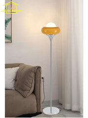 Modern amber glass iron led floor lamp with sleek chrome stem and white base for stylish living room decorbites glass iron
