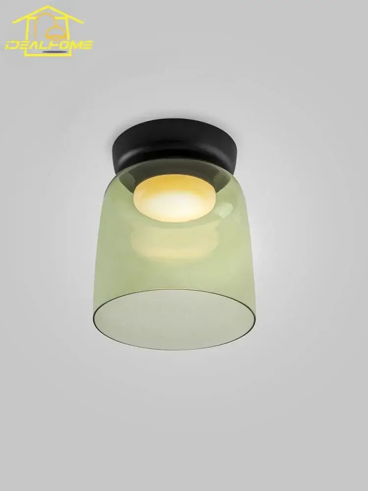 Modern amber glass led ceiling light with matte black base and translucent olive-green shade for living room ceiling light