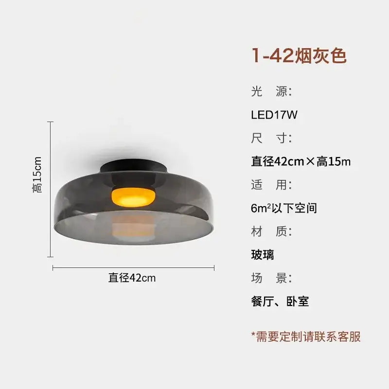Modern amber glass led ceiling light with smoked glass and black base emitting warm yellow illumination for living room