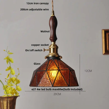 Modern amber glass led pendant lamp with warm amber glass led shade, walnut wood handle, and brass accents for dining room