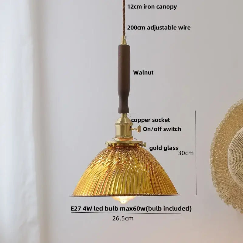 Vintage-style pendant lamp with textured amber glass led shade, brass copper socket, and walnut wood handle for dining room