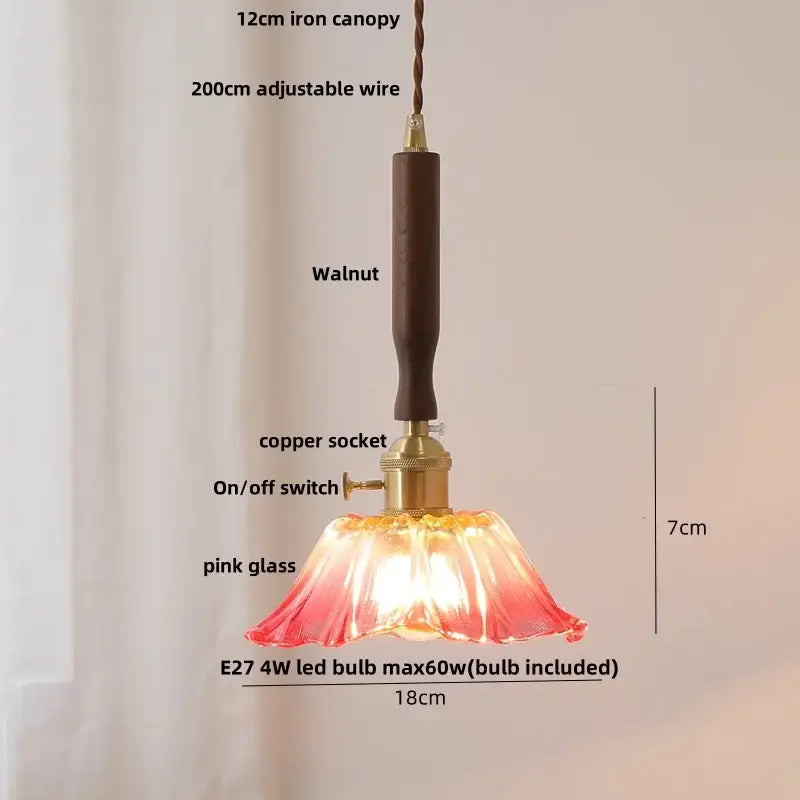 Modern amber glass led pendant light with delicate pink glass shade, walnut wood canopy, and copper socket decorbites amber glass