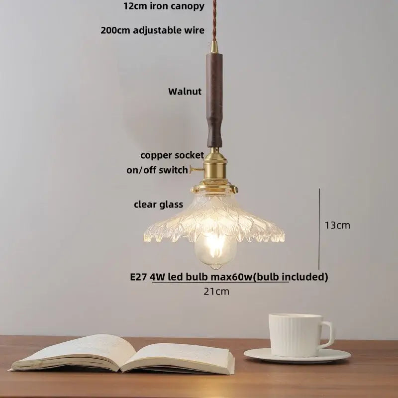 Modern amber glass led pendant light with walnut wood handle, iron canopy, brass copper socket, and floral pattern shade