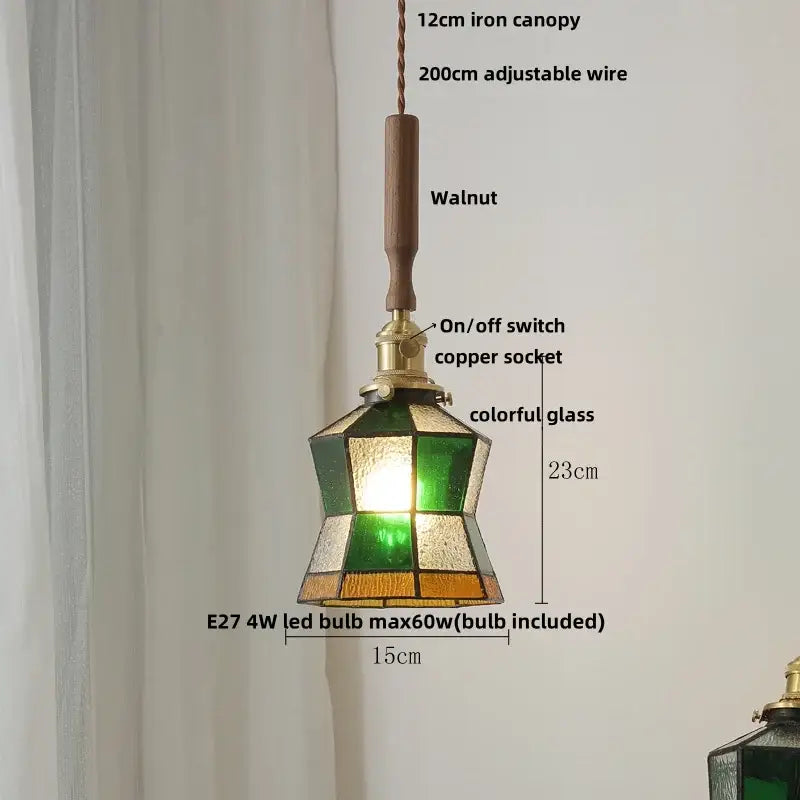 Modern amber glass led pendant light with geometric green and amber shade suspended from walnut wood handle