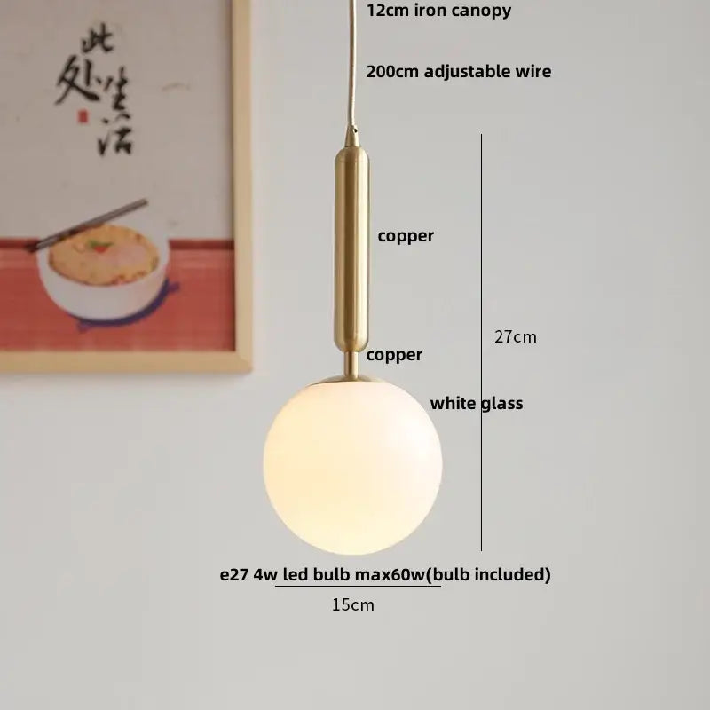 Modern amber glass led pendant light with frosted white globe and copper tone metal for dining room illumination