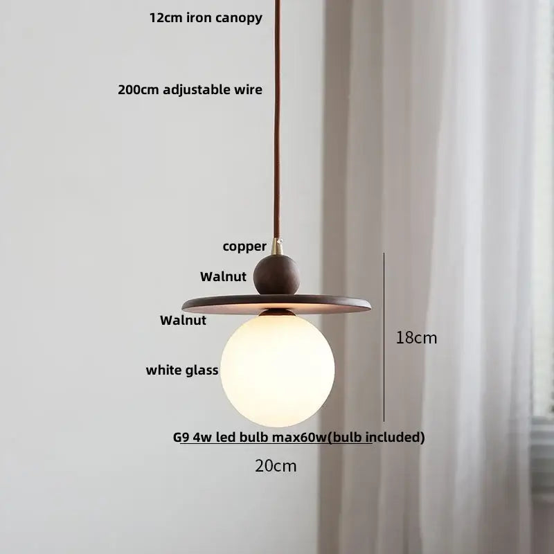 Modern amber glass led pendant light with warm copper iron canopy walnut wood accents and white glass globe for dining room