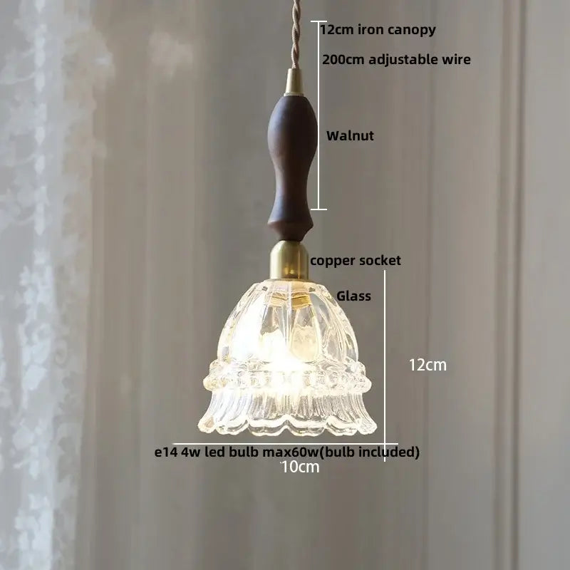 A delicate 12cm modern amber glass led pendant light with scalloped fluted design and warm brass copper socket