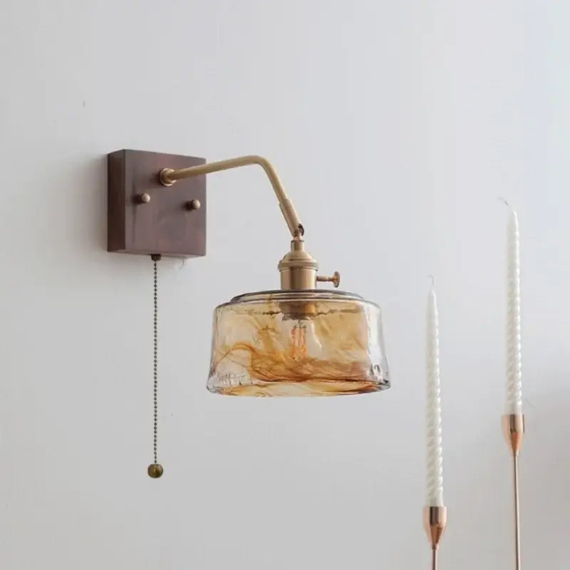 Modern amber glass led wall sconce with brass finish and swirling pattern shade for bedroom decorbites led wall lighting