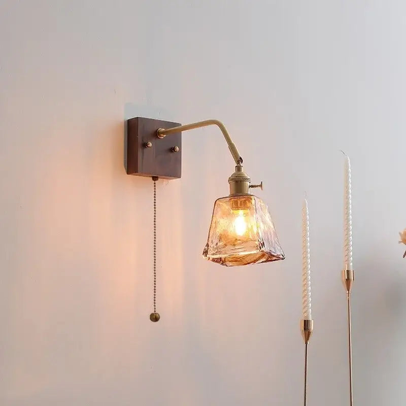 Modern amber glass led wall sconce with brass finish and adjustable arm for bedroom decorbites led wall lighting