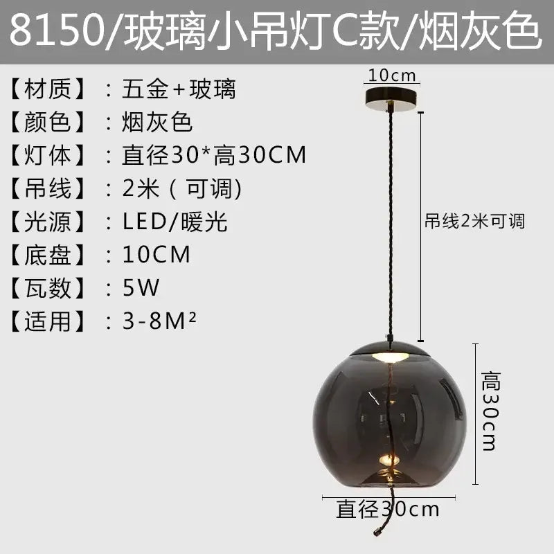 Modern amber glass pendant light with smoke-gray globe and metallic hardware perfect for decorbites brokis knot decor