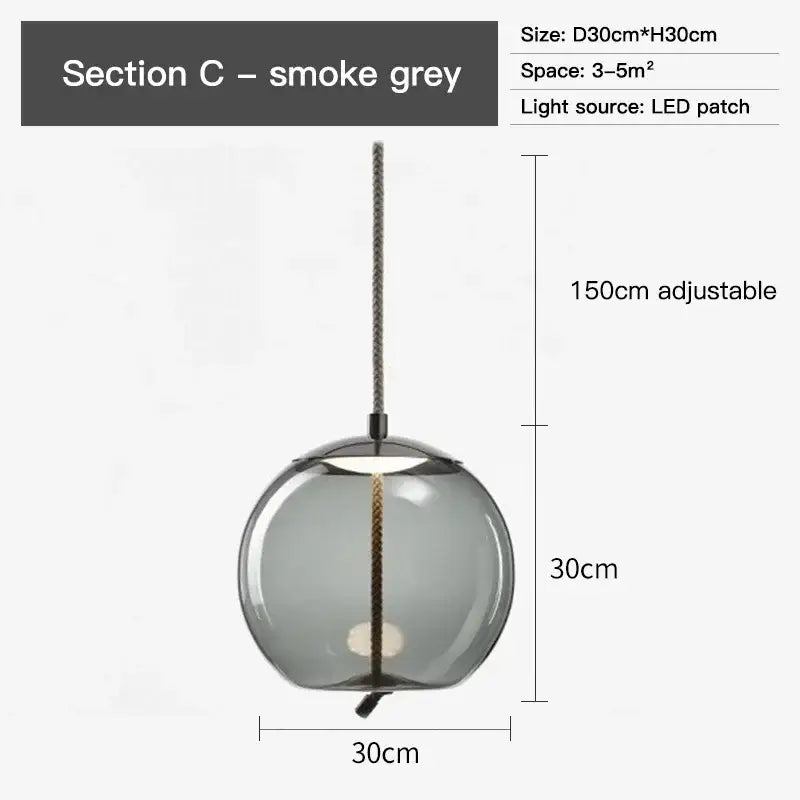 Modern amber glass pendant light with smoke grey clear globe, black metal hardware, and adjustable 150cm chain decorbites brokis knot glass
