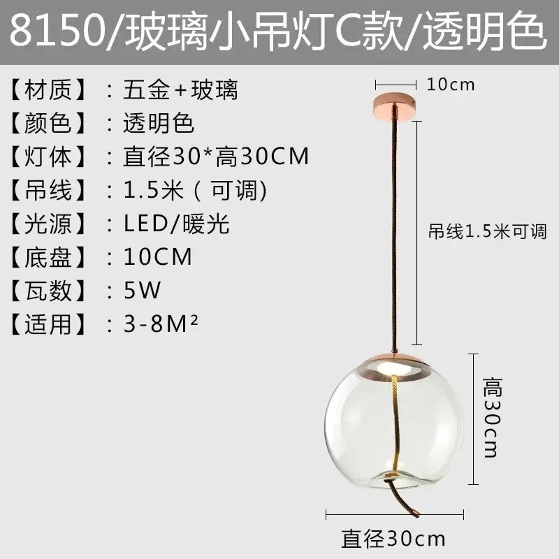Modern amber glass pendant light with rose gold metal accents featuring brokis knot glass and led warm white bulb