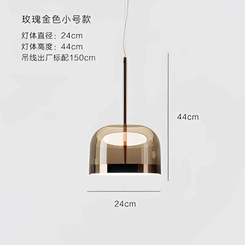 A modern amber glass pendant light with minimalist design and copper finish perfect for dining room use