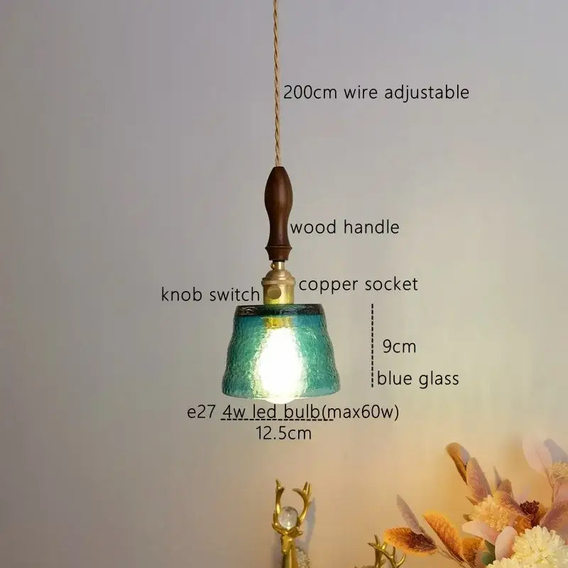 Modern amber glass pendant light with teal-blue textured glass, wooden handle, and copper socket for dining room decorbites amber pendant