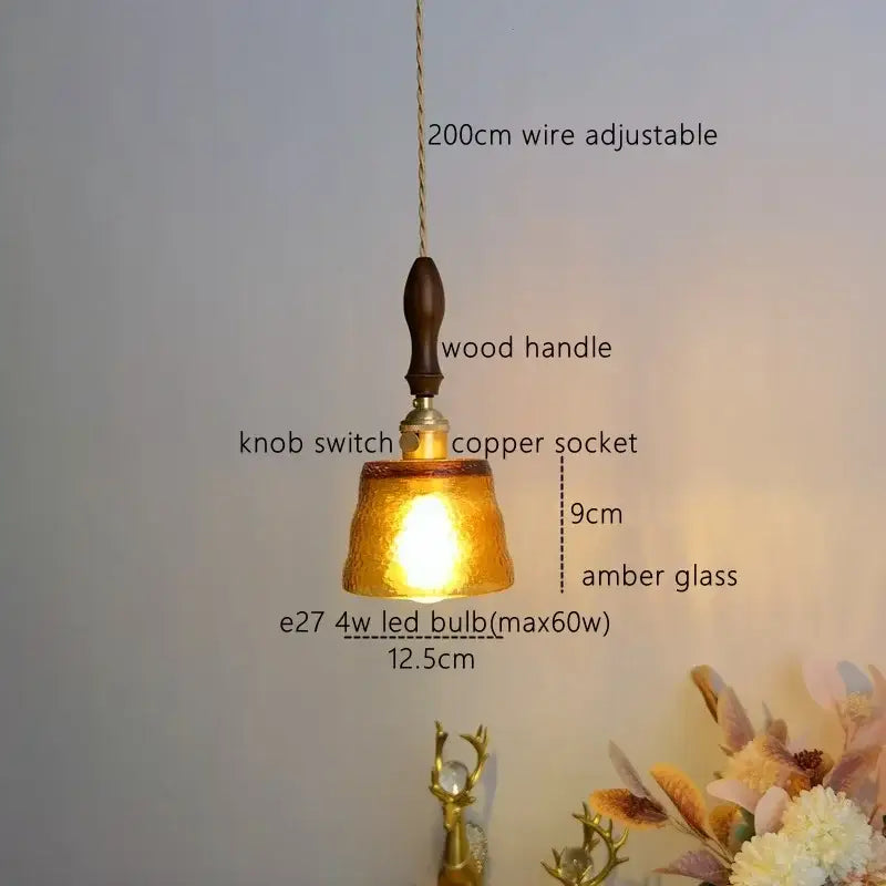 Modern amber glass pendant light with dark wood handle and copper socket for dining room decorbites amber pendant light