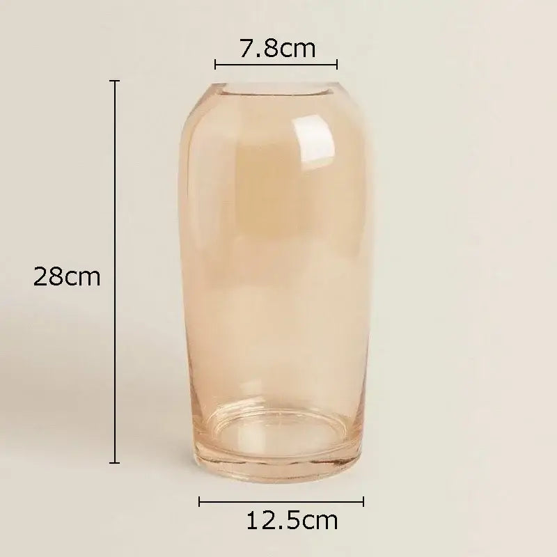 A tall translucent peach decorbites amber glass vase with a smooth rounded body and flared rim for living room decor