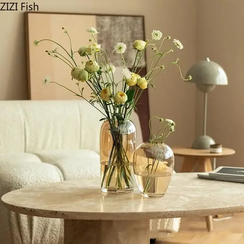Two clear decorbites amber glass vases transparent with yellow and white flowers for modern living room decor
