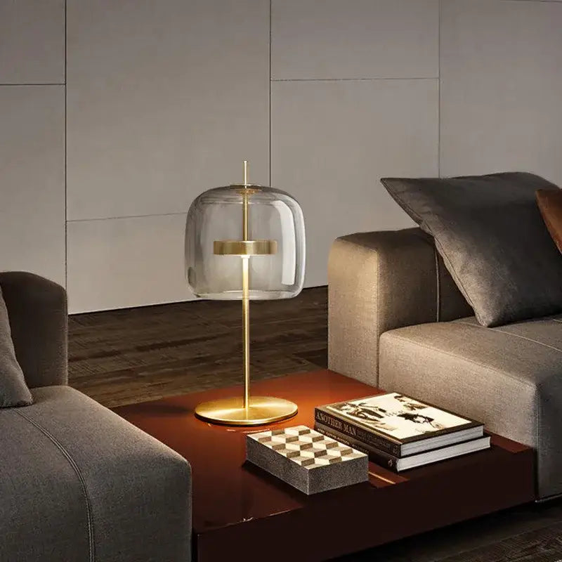 Modern amber and gray decorbites glass table lamp with transparent dome and gold base for bedroom lighting